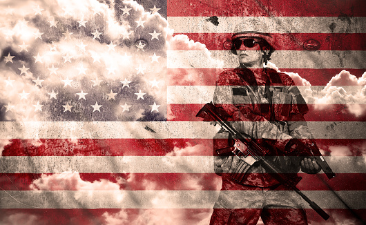 soldier with rifle on a usa flag background, double exposure