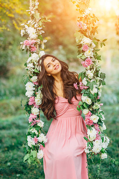 istock Beautiful young girl on a swing 482329832
