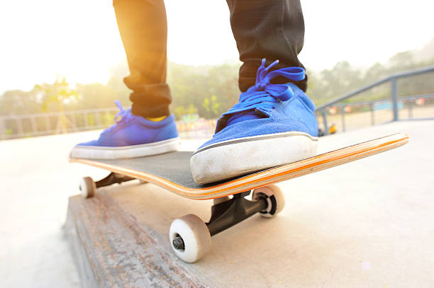 istock Legs in sneakers on a skateboard 482330345