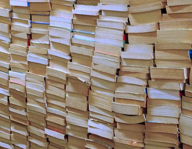 istock books piled up for sale in the great library 482333086