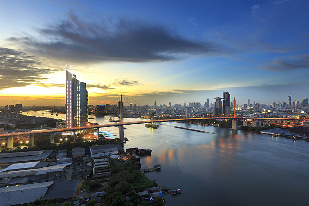 istock Bangkok office building riverside at sunset, before Night Falls 482333174
