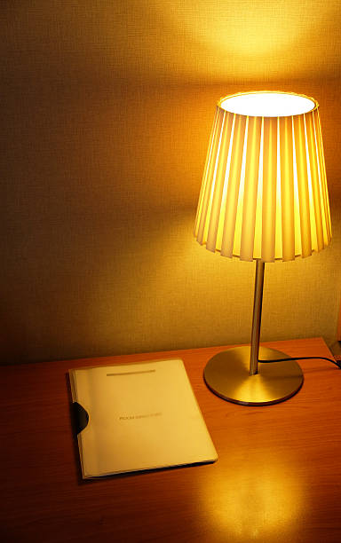 istock Lamp shade in a hotel room with room directory. 482335030