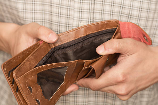 empty wallet empty wallet in the hand empty pockets stock pictures, royalty-free photos & images