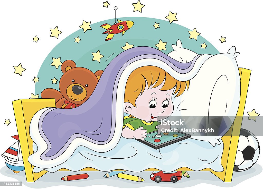 Boy playing on a tablet Little boy plays on a tablet computer under a blanket in his bed American Football - Ball stock vector