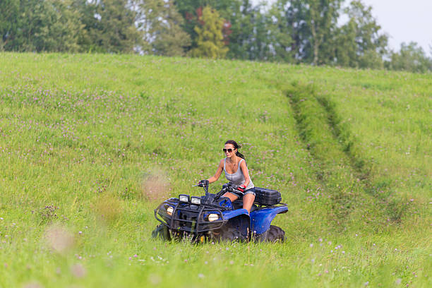 istock Elegant woman riding extreme quadrocycle 482336027