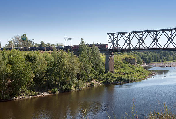 istock train drives on the bridge through  river Narva. Estonia. 482336690
