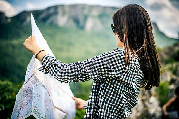 istock Tourist with a map on the mountain 482340734