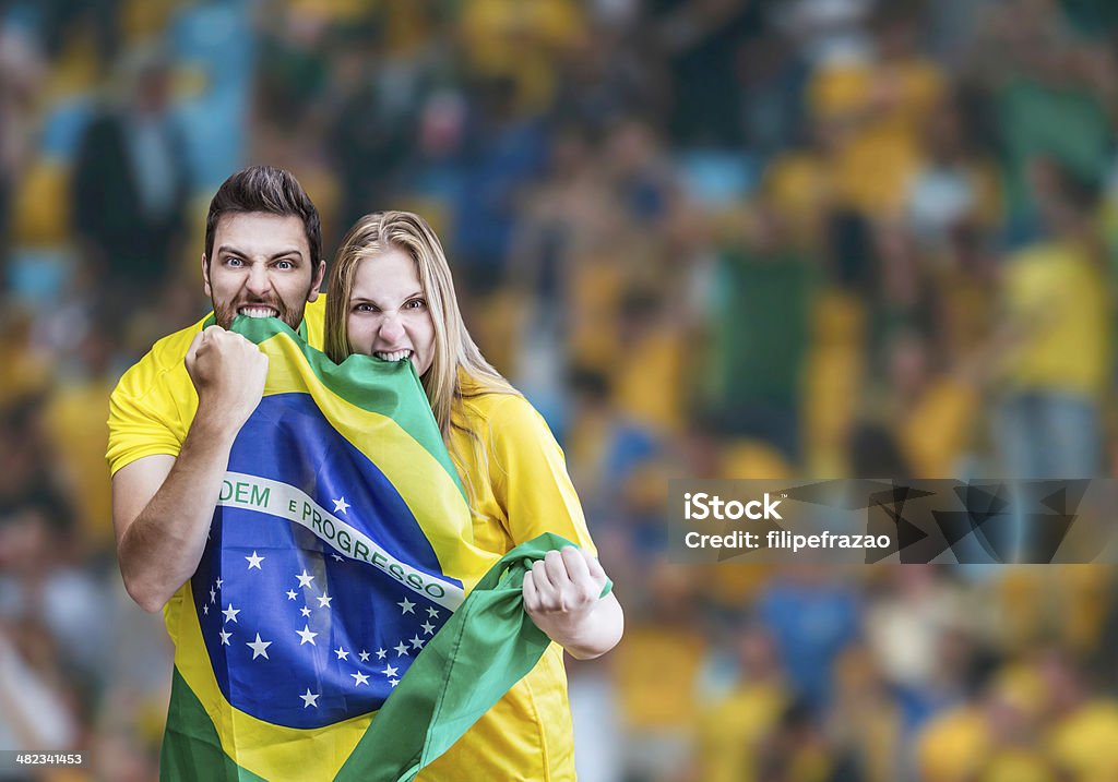 Brazilian fans celebrate on the stadium International Soccer Event Stock Photo