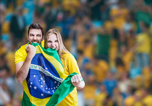 Brazilian fans celebrate on the stadium Brazilian fans celebrate on the stadium football2014 stock pictures, royalty-free photos & images