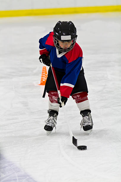 istock Boy at ice hockey practice 482341613