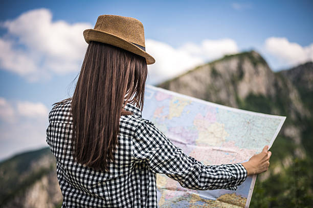istock Tourist with a map on the mountain 482341622