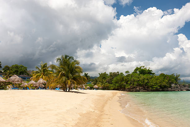 istock Beach on tropical island. Clear blue water, sand, clouds 482342406