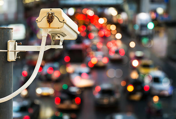 Back view of CCTV Camera with traffic jam light bokeh Back view of CCTV Camera with traffic jam light bokeh in the background cityscape videos stock pictures, royalty-free photos & images