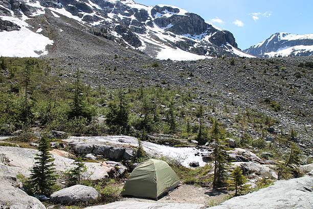 istock Tent in rocky and snowy landscape 482343260