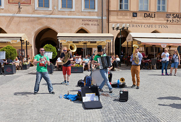 Street band Circus Problem in Prague Prague, Czech Republic - May 11, 2015: Street band named Circus Problem makes public (nonticketing) performance on the Old Town Square of Prague  klezmer stock pictures, royalty-free photos & images