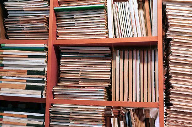 istock books piled up for sale in the great library 482344280