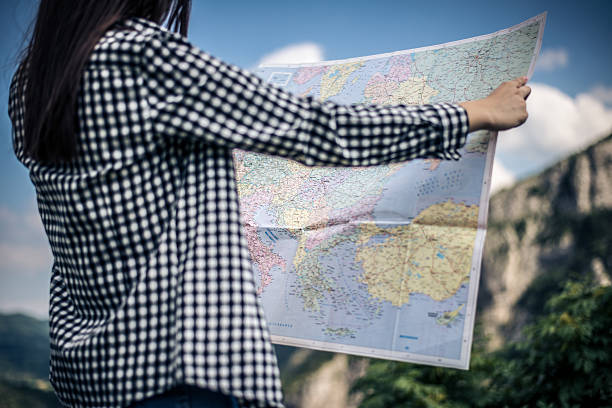 istock Tourist with a map on the mountain 482344896