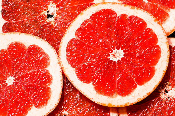 istock Slices of red grapefruit, top view, selective focus 482351496