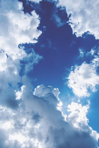 Panoramic skyscape from the horizon of clouds in a blue sky in summer.