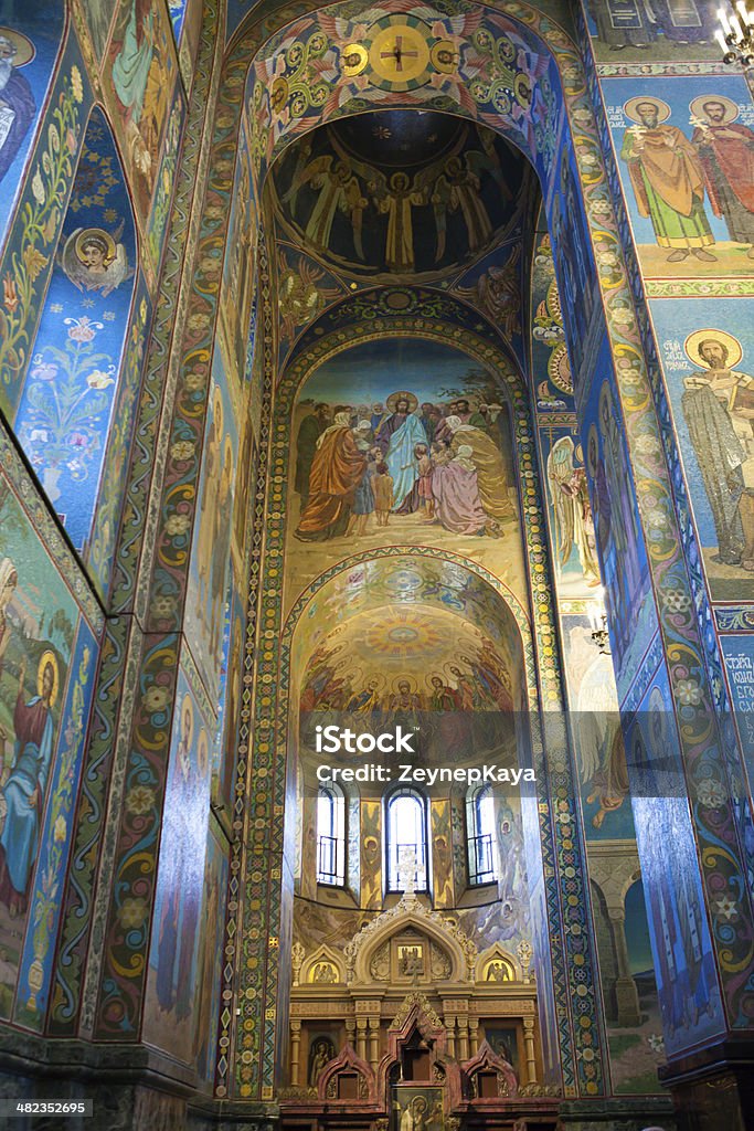 Mosaics interior of Orthodox cathedral in St Petersburg Mosaics in interior of The Church of the Savior on Spilled Blood. The church was built between 1883 and 1907 and was officially called the Resurrection of Christ Church (a.k.a. The Church of Our Savior on Spilled Blood ). The interior of the church is decorated with incredibly detailed mosaics, designed and created by the most prominent Russian artists of the day (V.M. Vasnetsov, M.V. Nesterov and M.A. Vrubel). Apostle - Worshipper Stock Photo