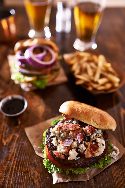 istock two gourmet cheeseburgers with beer 482356574
