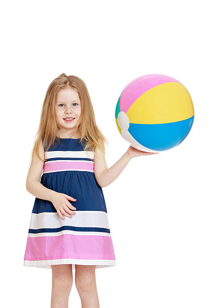 istock Girl holding a ball 482356924