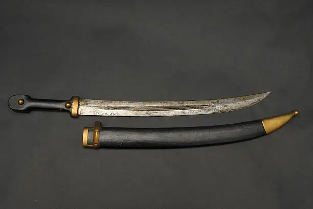 Russian Imperial saber sword with leather scabbard and brass mounts.