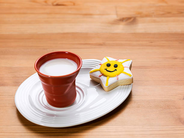 istock Cup of Milk and smiling cookie 482360465