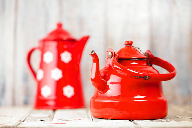 istock Red and white Enamel Tea Coffee Pots on wood 482361008