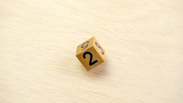 istock Wooden dice on a wooden table surface with alphabet letter 482361462
