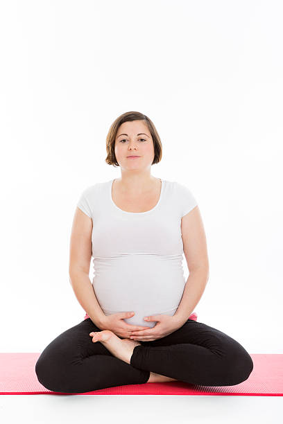 istock Pregnant woman practicing yoga 482362741