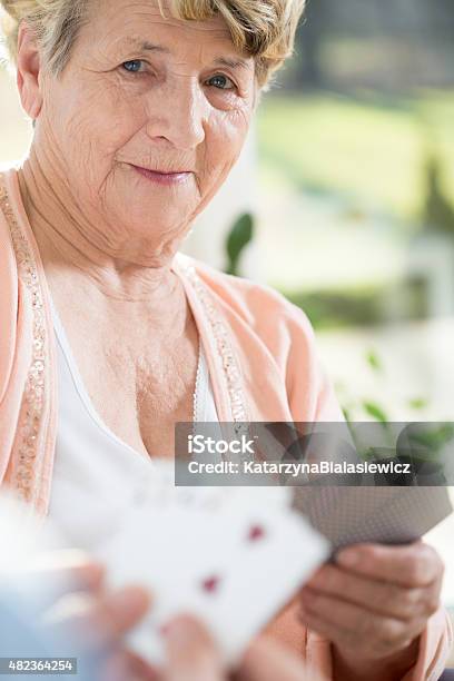 Playing Cards With Old Woman Stock Photo - Download Image Now - 2015, Active Seniors, Adult