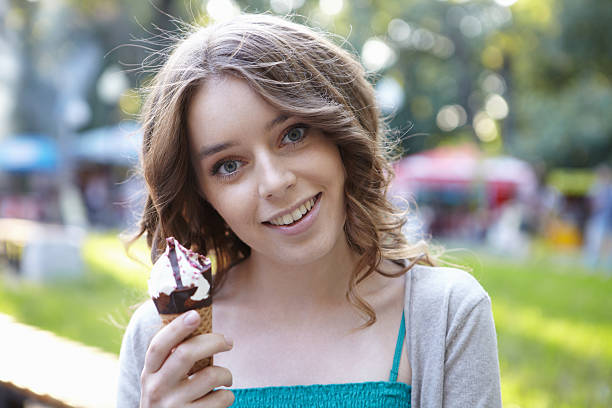 istock Young beautiful woman with ice cream. 482364459