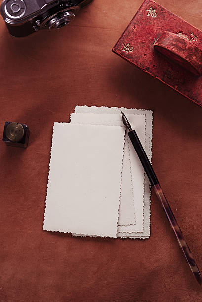 istock vintage red leather ink blotter  with retro post cards 482365114