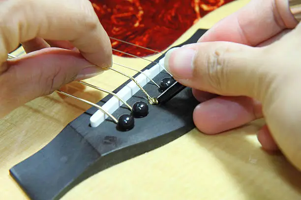 Photo of changing the guitar strings