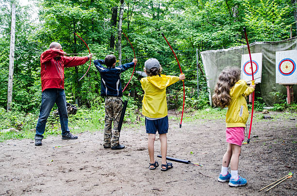 istock Family throwing arrows at target 482365770
