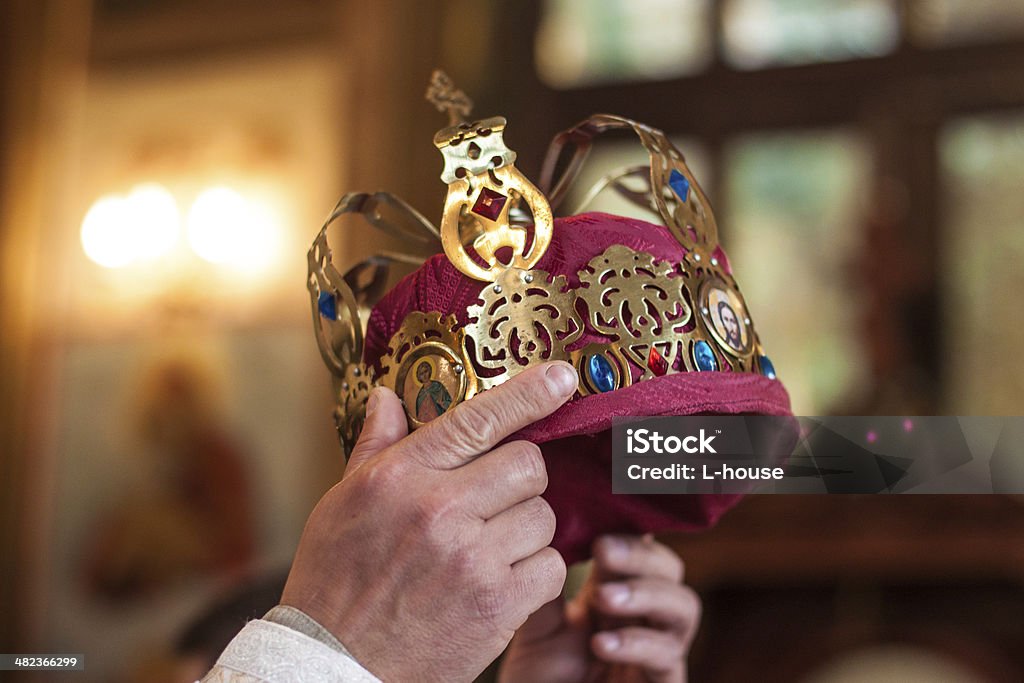 Moment of coronation Crown in the hands of the pastor at the time of the coronation King - Royal Person Stock Photo