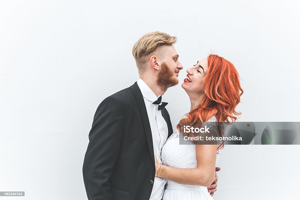 Wedding couple on a background of whitewall Wedding couple on a walk in the estate of the Belvedere in Vienna 2015 Stock Photo