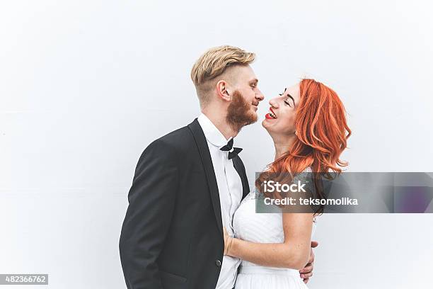 Wedding Couple On A Background Of Whitewall Stock Photo - Download Image Now - 2015, Adult, Adults Only