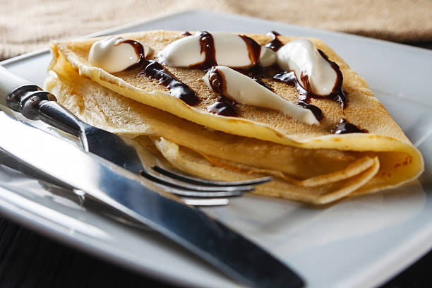 istock Sweet pancake with chocolate sauce and yogurt 482366871