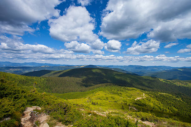 istock road to the mountains with blue sky in Carpathian 482367433