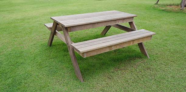 istock Timber garden table on green glass 482367860