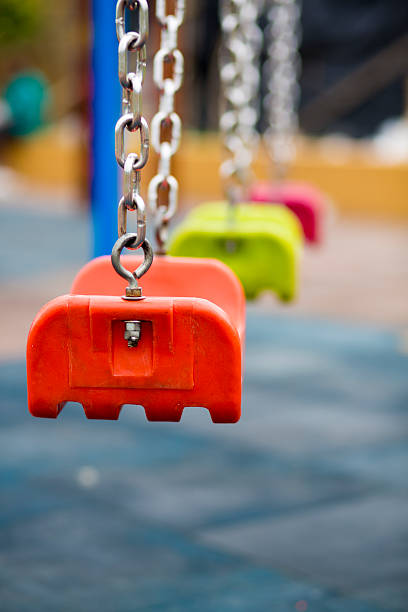 istock Close up of empty swing in a playground 482369154