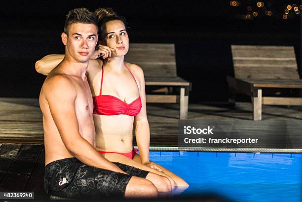 Couple At The Swimming Pool Stock Photo - Download Image Now - 18-19 Years, 20-29 Years, 2015