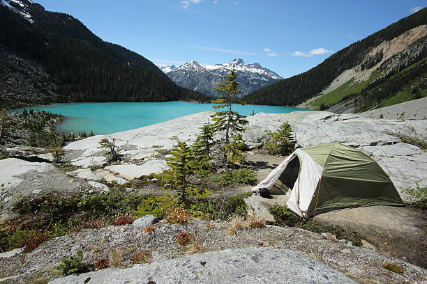 istock Hiking tent above a turquoise lake 482369372