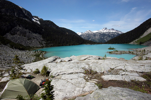 Camping in a remote wilderness above a turquoise colored lake