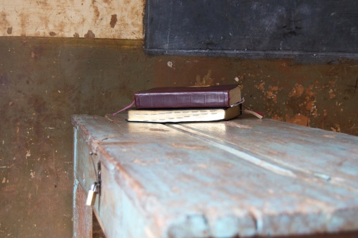 Bible sitting at the front of a church classroom ready to be read