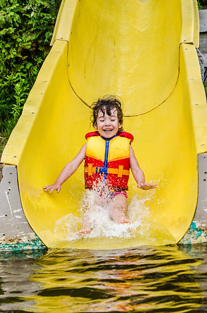 istock Girl in a water slide 482374538