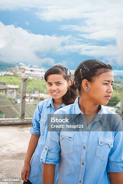 Two Asian Descent Teenage Girl Friends Hanging Out Stock Photo - Download Image Now