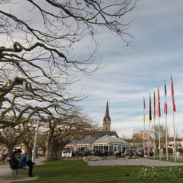 Radolfzell, Germany - March 29, 2014: People enjoying the nice weather with warm temperatures at the promenade radolfzell at the lake of contance.